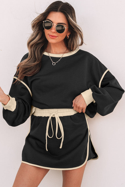 Black loose pullover and lace up waist skort set
